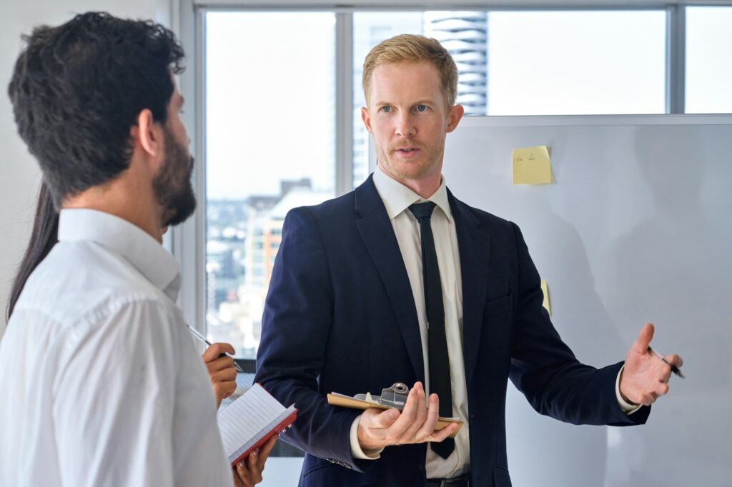 Business man presenter team leader giving presentation in office.